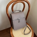 Vintage taupe faux leather handbag with embossed geometric details and silver ball pendant - Khaki