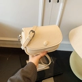 Chic cream white crossbody bag with lychee texture leather and a matching fabric buckle - White