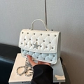 Bright white quilted faux leather handbag with silver studs and star emblem detail - White