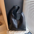 Minimalist black pebbled leather hobo bag with adjustable silver buckle shoulder strap - Black