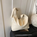 Minimalist creamy white bucket bag in crinkled oil wax leather texture - Off White