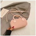 Pink bowling style crossbody bag with MIOIER & BAGS text and silver hardware details - Pink