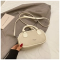 Beige lychee pattern mini bowling handbag with adjustable shoulder strap and dual handles - Off White