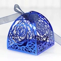 Detail of laser-cut navy blue wedding favor box with rose patterns and ribbon bow - Dark Blue