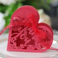 Detail of red laser-cut heart candy box with Love lettering and red silk ribbon - Pearlescent Red