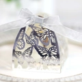 Macro detail of laser-cut butterfly hollow pattern on mirror silver wedding gift box - Reflective Silver