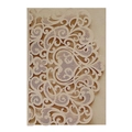 Detail view of champagne laser cut invitation card with intricate floral lace pattern - Beige Gold