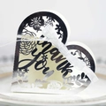 Close-up of laser-cut heart favor box with silver mirror finish and white ribbon bow - Reflective Silver