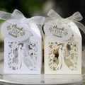 Detail of laser-cut wedding candy boxes with couple silhouette and ribbon tags - Style With Thank You Tag
