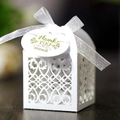 White laser-cut wedding favor box with floral patterns and a thank you tag ribbon - White