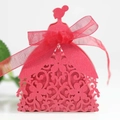 Close-up of laser-cut girl silhouette wedding candy box in red with elegant ribbon - Pearlescent Red