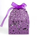 Detail of purple laser-cut flower patterns and chiffon ribbon on a wedding favor box - Deep purple