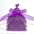 Macro detail of purple laser-cut wedding favor box with floral pattern and silk bow - Dark Purple