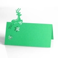 Detailed laser-cut Christmas reindeer and snowflake design on green festive table place card - Dark Green