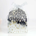 Detailed laser-cut silver candy box with intricate floral pattern and matching ribbon bow - Reflective Silver