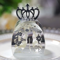 Macro view of silver laser-cut wedding favor box with crown detail and bride groom pattern - Reflective Silver
