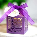 Detail of purple laser-cut wedding favor box with organza bow and Thank You tag - Deep purple