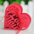 Red heart laser-cut candy box with floral patterns and red organza ribbon detail - Pearlescent Red