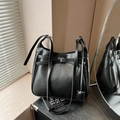 Minimalist black faux leather bucket bag with silver twist lock and adjustable strap - Black