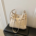 Chic cream white bucket bag in faux leather with silver twist lock and crossbody strap - Apricot