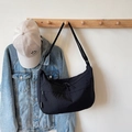 Minimalist black nylon crescent crossbody bag with adjustable strap in casual style - Black