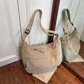 Minimalist crescent moon crossbody bag in beige nylon fabric with adjustable wide strap - Khaki