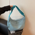 Minimalist light blue nylon crescent crossbody bag with adjustable wide fabric strap - Blue