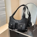 Minimalist black PU leather shoulder bag featuring dual utility pockets with silver buckles - Black