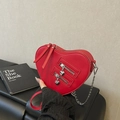 Red heart-shaped crossbody bag with silver chains and dual zipper heart pendants - Red