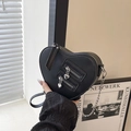 Fashionable heart-shaped black leather crossbody bag with silver chain and dual zippers - Black