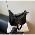 Detail of black glossy crinkle texture crossbody bag with silver twist lock and strap - Black