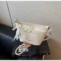 Detail of white pleated handbag with pearl bow charm and lace trim on book - With Charm / Off White