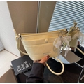 Close-up of pale yellow crossbody bag featuring wrinkled leather and lace pearl bow - With Charm / Yellow