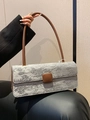 Chic silver rectangular baguette bag with embossed texture and slim brown shoulder strap - Gray