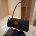 Fashionable black baguette bag with brown leather strap and decorative square buckle - Black