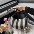 Handwoven shoulder bag featuring black and white vertical stripes and a cute floral charm - Black with Pendant