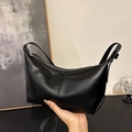 Sleek black faux leather crescent moon shoulder bag with adjustable strap and top zipper - Black