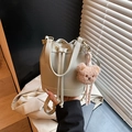 Beige litchi grain bucket bag with drawstring closure and cute plush bear charm - Gray With Pendant