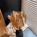 Khaki drawstring bucket bag in pebble leather with plush bear charm accessory - Khaki with Pendant