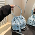 Light blue bucket bag with silver studs, drawstring closure and chain shoulder strap - Blue