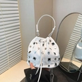 White vintage bucket bag with silver rivet studs and drawstring closure - White