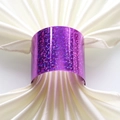 Close-up of sparkling purple glitter napkin ring on a folded white satin cloth - Glitter Purple