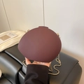 Deep red round acrylic handbag with matte finish and fine gold chain shoulder strap - Brown