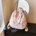 Compact light pink nylon travel backpack with multi-pocket design and wide straps - Pink