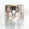 Detail of silver mirror metal candle holder with intricate laser-cut snowflake patterns - Double-Sided Reflective Silver