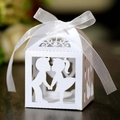 Laser-cut white wedding favor box featuring a romantic couple silhouette and white ribbon - White