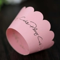 Pink laser-cut lace cupcake wrappers with scalloped edges and Cake Play script - Pink