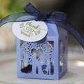 Macro detail of laser-cut lavender tree candy box with blue ribbon and thank you tag - Sapphire Blue
