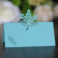 Macro detail of laser-cut maple leaf place card in sky blue pearlescent paper finish - Tiffany Blue