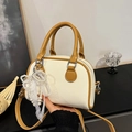 Chic cream litchi texture Boston handbag with brown handles and elegant pearl lace charm - Beige